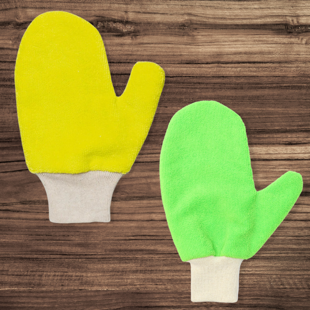 A yellow and a grey oven mitt on wooden background.